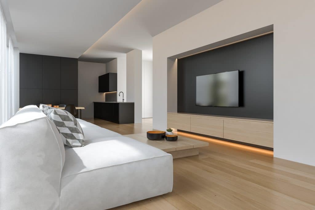 Interior de salón moderno sobrio con sofá y muebles